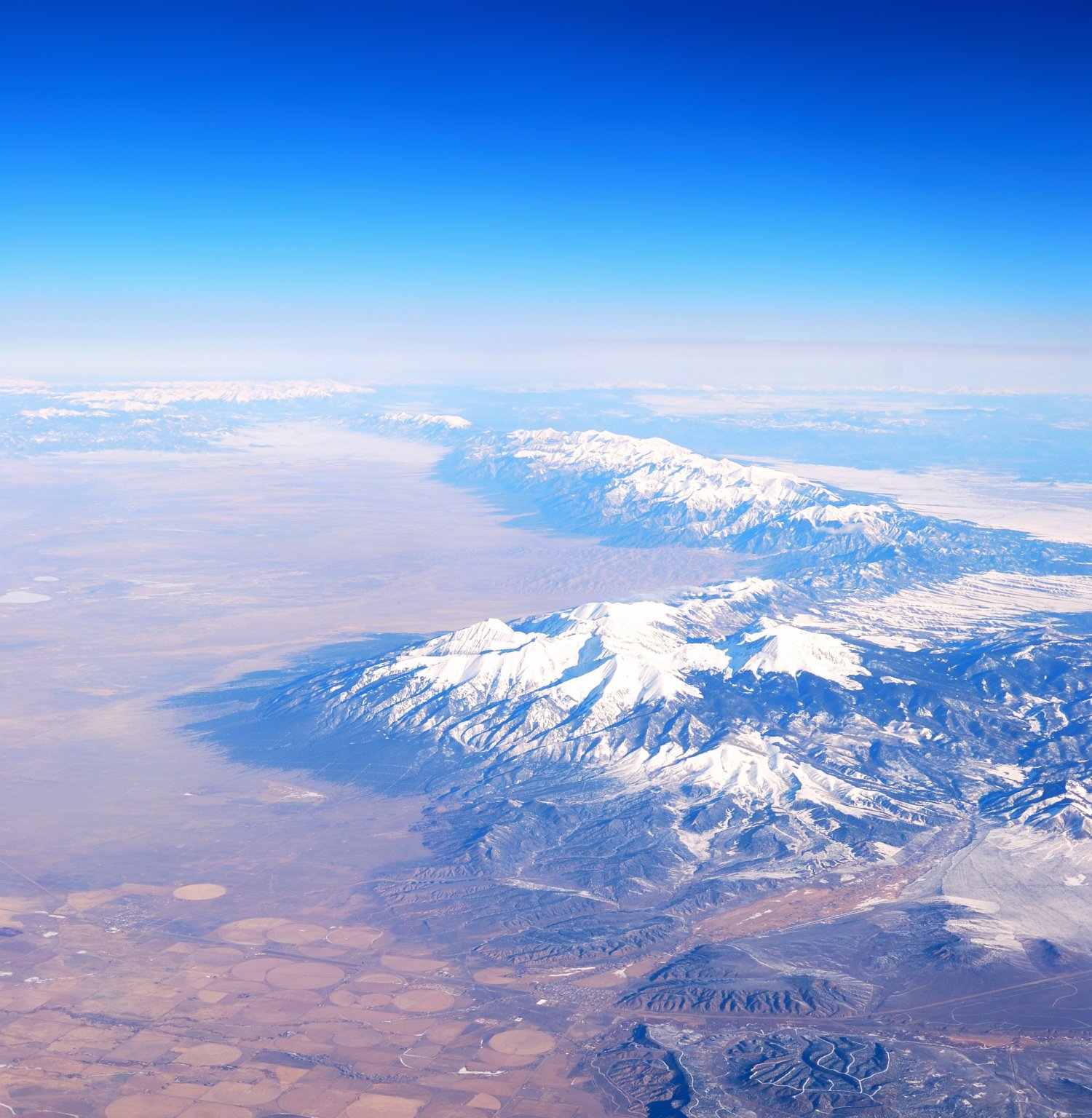 Snow-capped mountains seen from high altitude, sovereign access to the high atmosphere